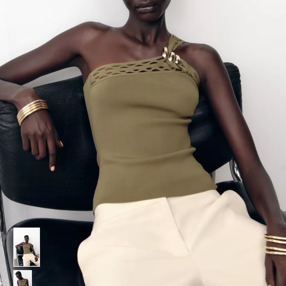 Zara Asymmetric neck top with wide strap, gold hardware, and cutouts.